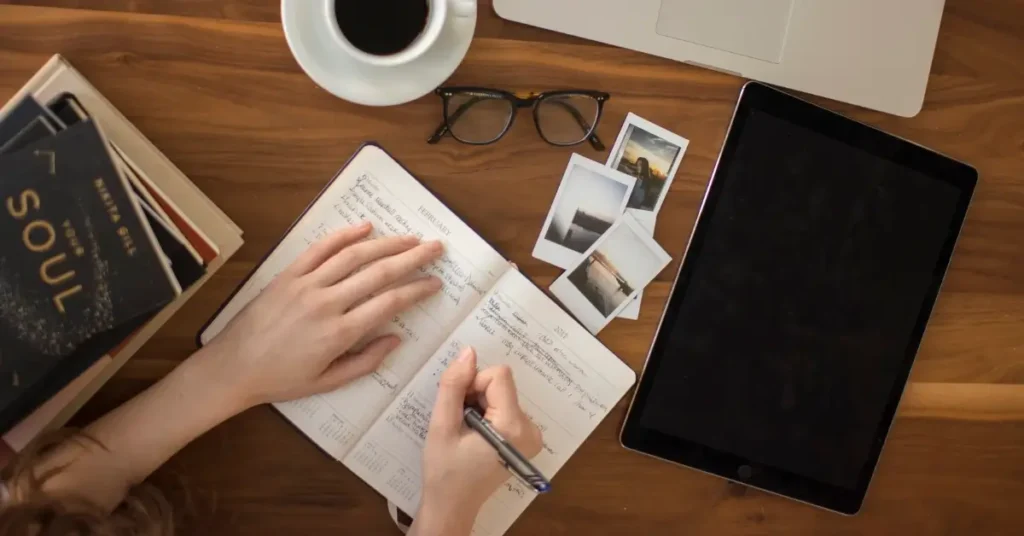 Opened notebook on a wooden desk